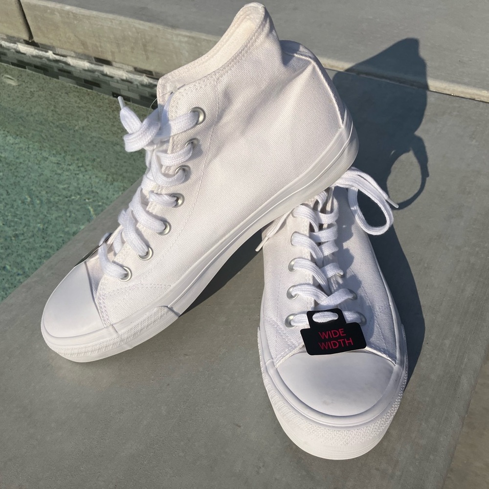 White sneakers with tags